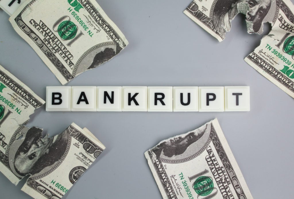 bankrupt torn-paper-money-with-letters