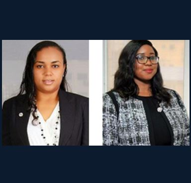 Two professional women wearing business attire, posed for a corporate headshot in a legal office setting.