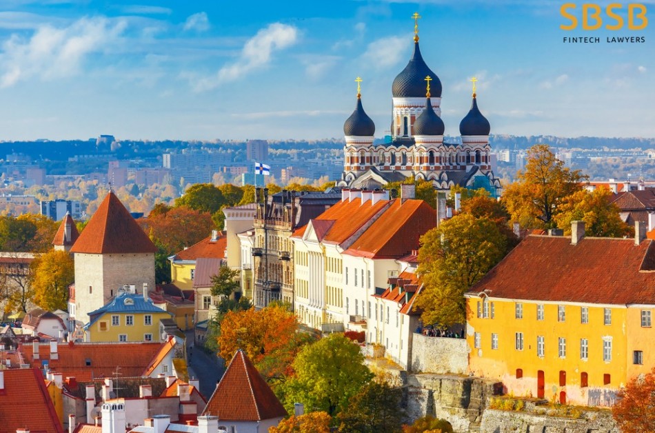 Panoramic view of Tallinn's historic architecture with fall foliage and the Alexander Nevsky Cathedral in the background.