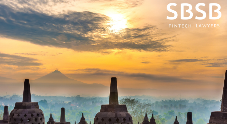 Scenic view of mountains and cloud-covered sky at sunset with ancient temples in the foreground.