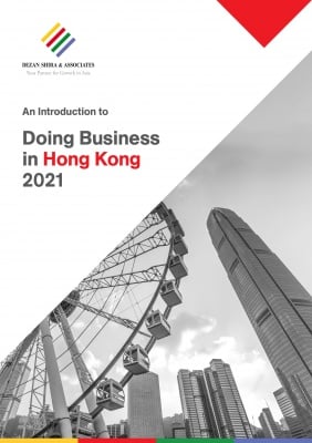 Document cover titled "An Introduction to Doing Business in Hong Kong 2021," featuring a cityscape with a ferris wheel.