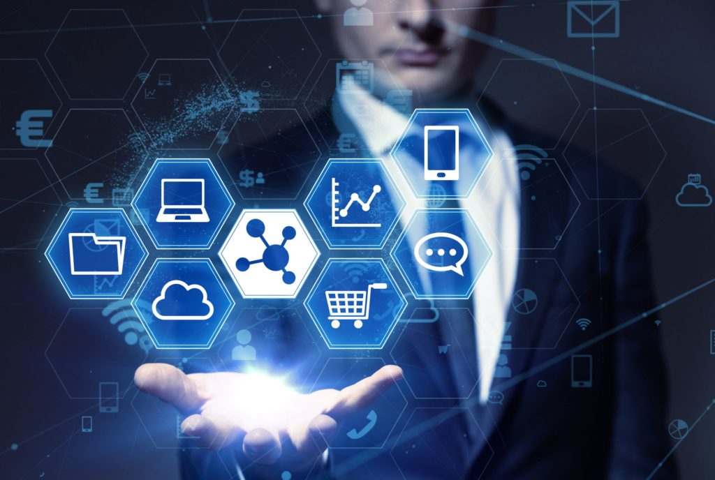 Business professional presenting digital technology icons in a futuristic setting.