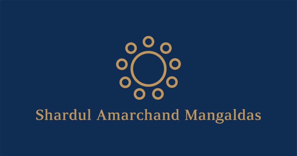 Legal logo of Shardul Amarchand Mangaldas with a circular design and firm name in gold on a dark background.