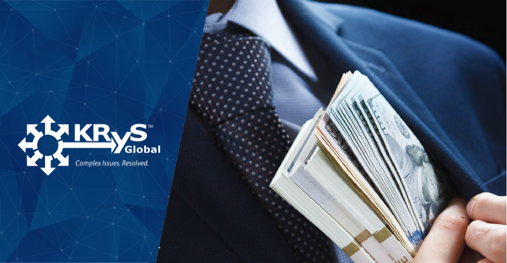 Business professional concealing cash in a suit pocket, suggesting financial implications or legal context.