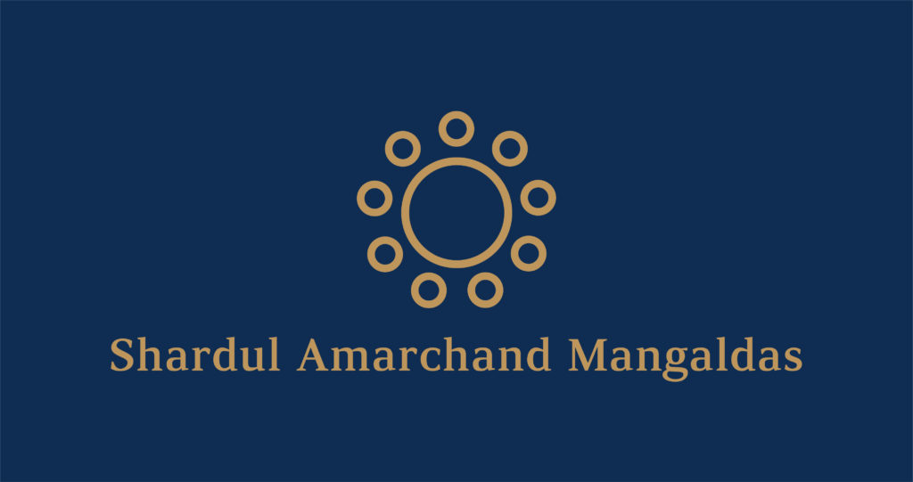 Logo of Shardul Amarchand Mangaldas with a gold circle design on a dark blue background.