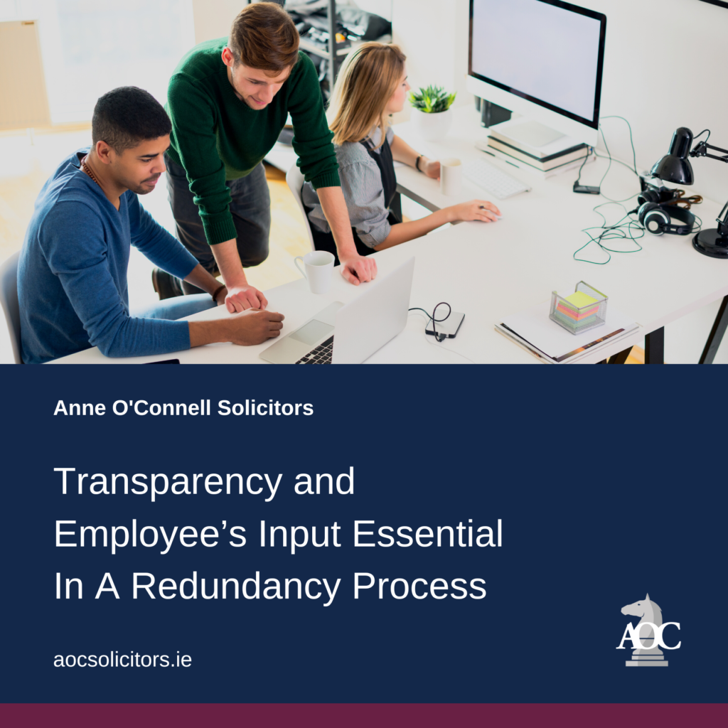 Group of young professionals collaborating on a legal project at a modern office workspace with laptops and documents.