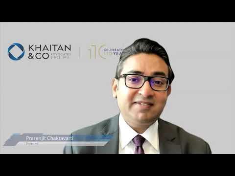 Partner at Khaitan & Co. speaking at a virtual conference, featuring law firm branding in the background.