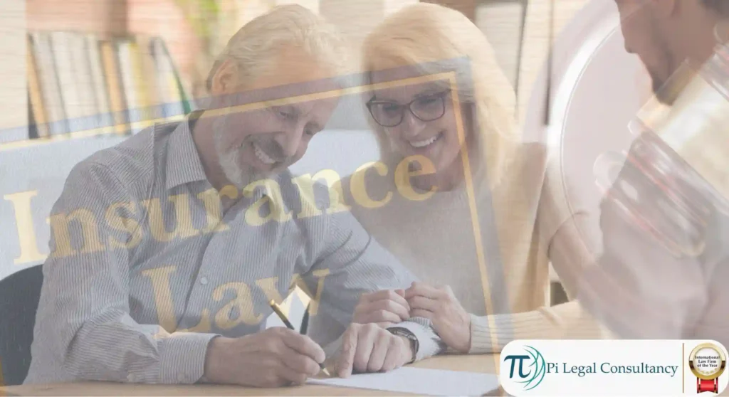 Lawyer consulting with clients on insurance law, reviewing documents at a desk in a legal setting.