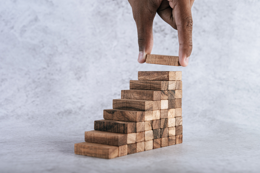 stacking-wooden-blocks-is-risk-creating-business-growth-ideas-1-1.jpg
