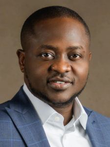 Ayobami Tunde - Professional man in a suit with a confident expression, suitable for a legal or business setting.