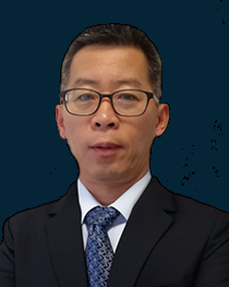 Legal professional in a suit, looking directly at the camera, with a neutral expression against a dark blue background.