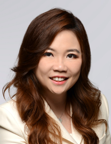 Professional woman with long brown hair, smiling and wearing a white blazer, suitable for a legal or corporate profile.