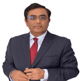 Attorney in a suit, standing and holding a pen, conveying professionalism in a legal setting.