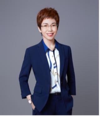 Legal professional in a suit smiling confidently against a neutral background.