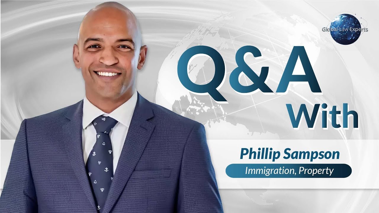 Immigration attorney Phillip Sampson smiling during a Q&A session about legal matters.