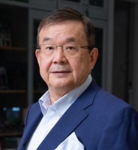 Legal professional posing confidently in a suit, positioned in a law office environment.