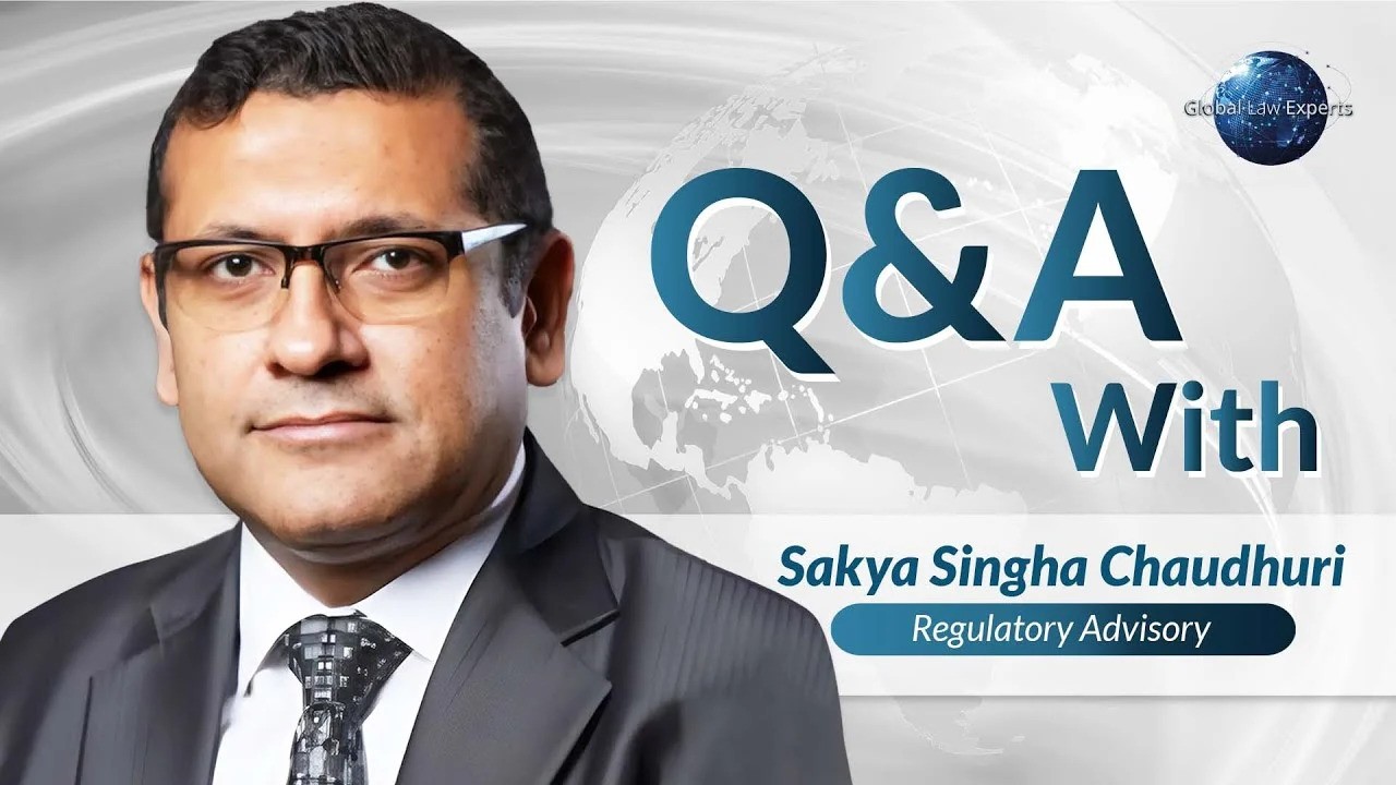 Regulatory advisory expert engaged in Q&A session on global legal issues.