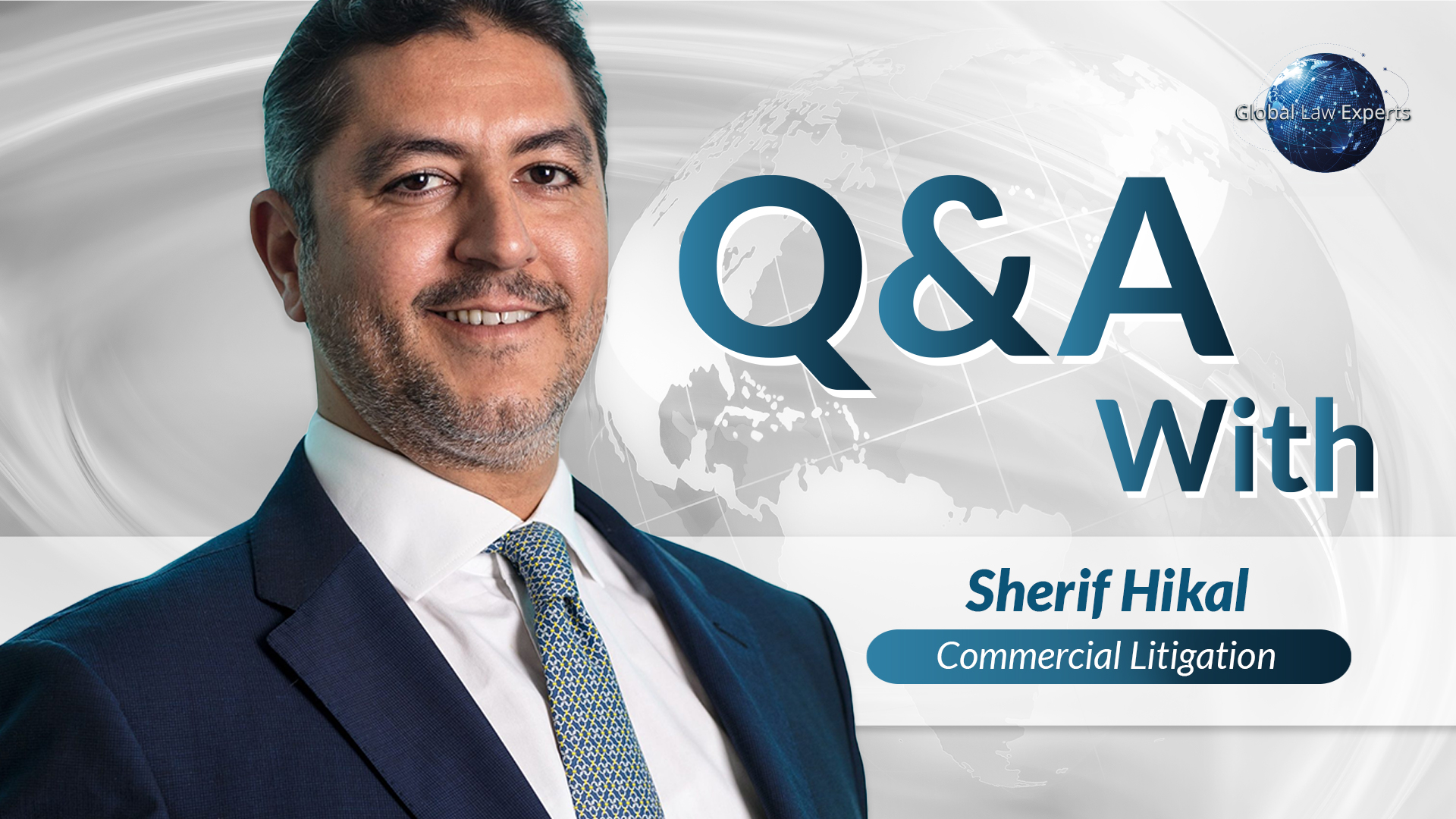 Legal professional in a suit smiling, featured in Q&A about commercial litigation. Background displays a globe design.