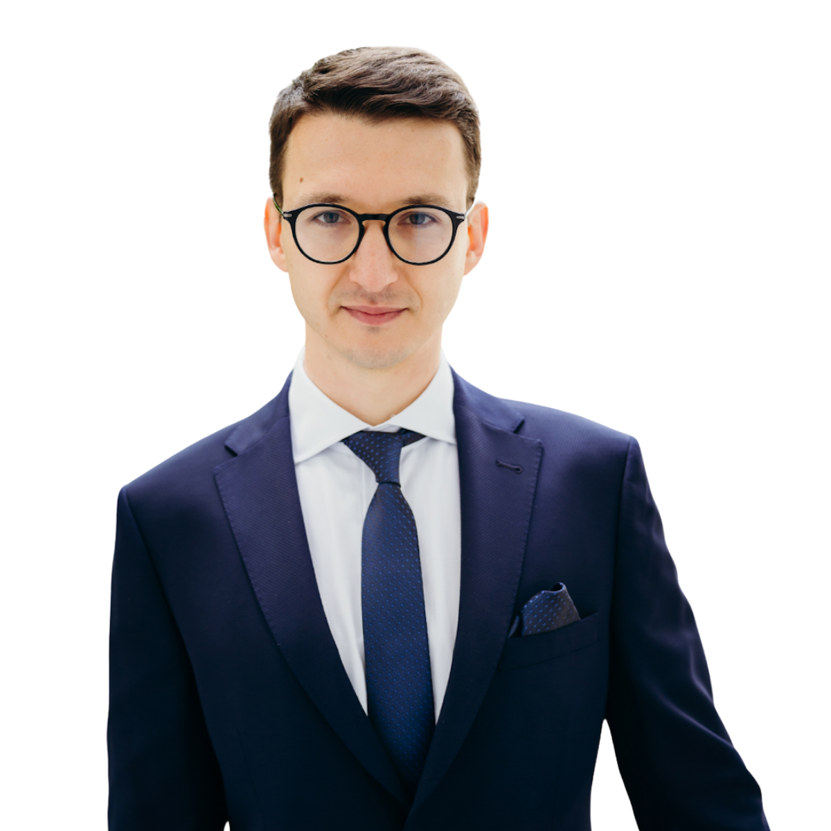 Lawyer in a navy suit and glasses posing confidently against a neutral background.