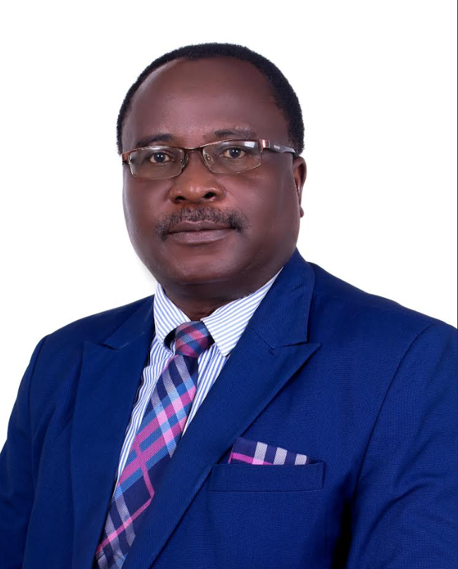 Attorney in a blue suit with a patterned tie, posed against a plain background for professional profile photo.