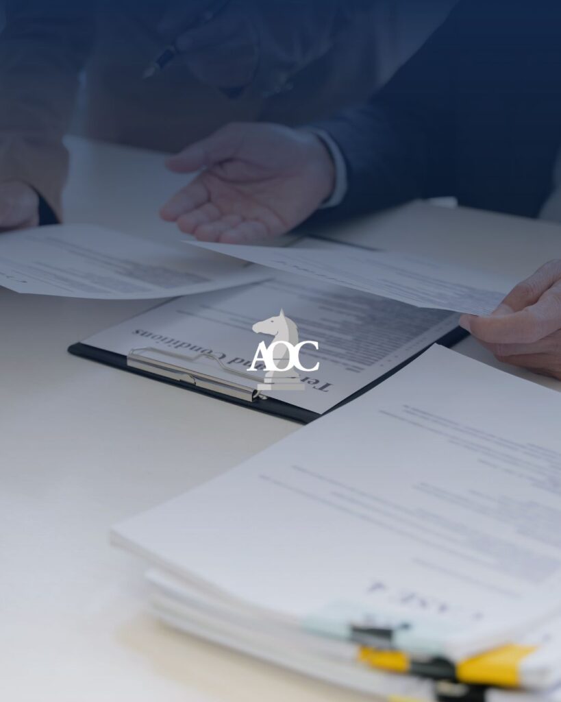 Lawyers discussing and reviewing legal documents on a table in a professional setting.