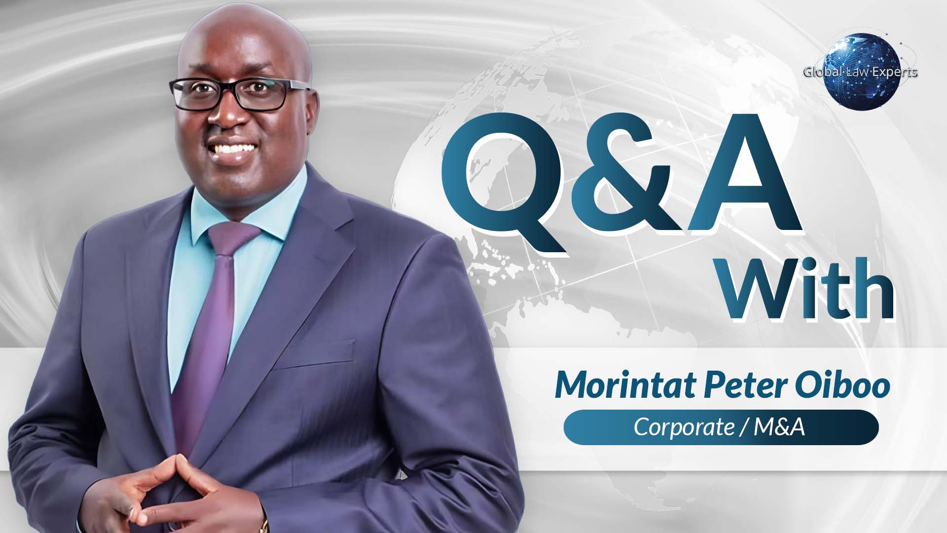 Attorney smiling and posing with hands clasped, backdrop features a globe and text, indicating a Q&A session.