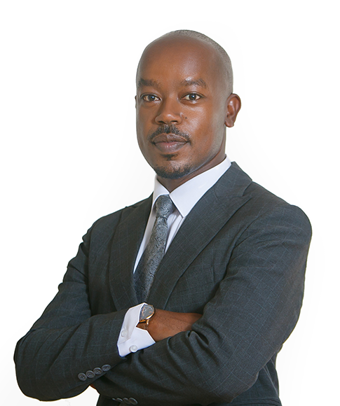 Legal professional with arms crossed, wearing a suit and tie, posing confidently against a white background.