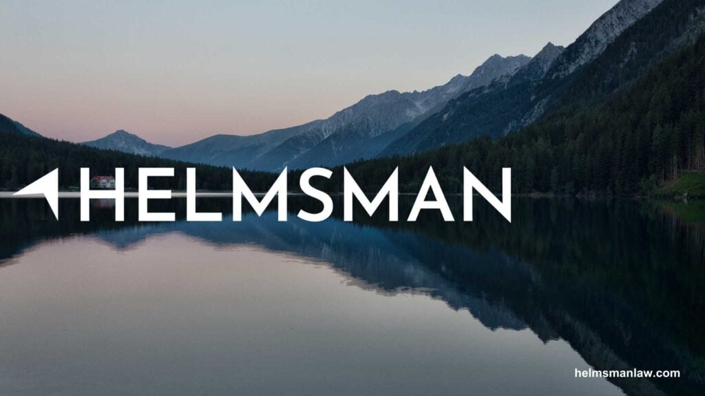 Nature landscape with mountains reflecting in calm lake under soft sunset colors, featuring the text "HELMSMAN" prominently.