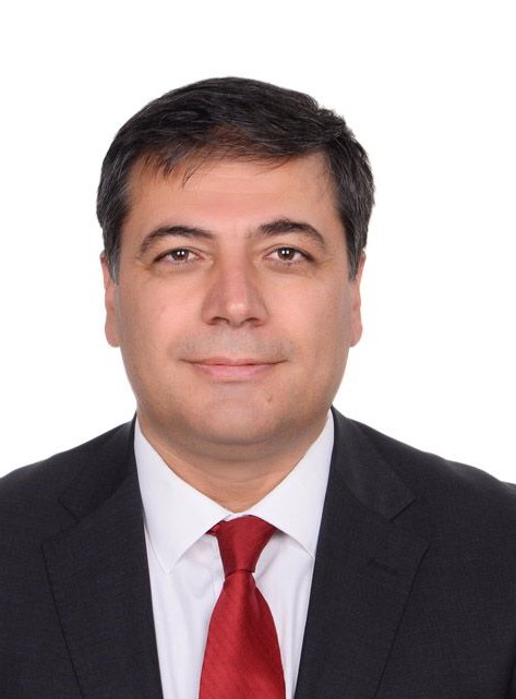 Male lawyer in a suit with a red tie, presenting a professional profile for legal directory.