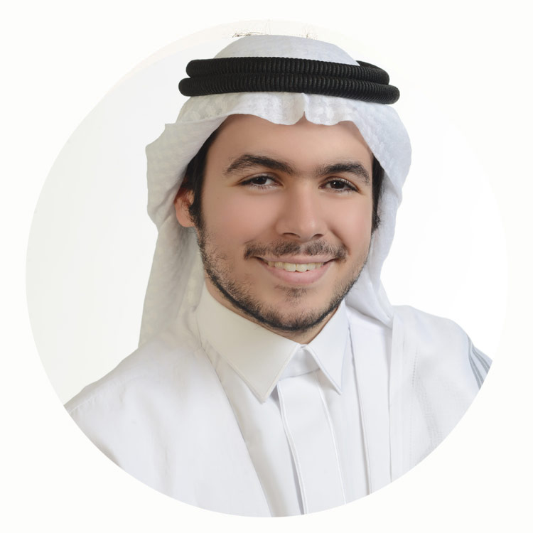 Male professional in traditional attire smiling, presented in a circular portrait format.