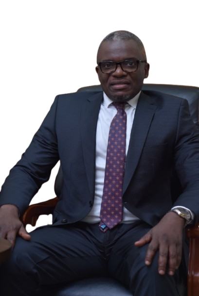 Lawyer seated in an office chair, wearing glasses and a suit, with a confident expression.