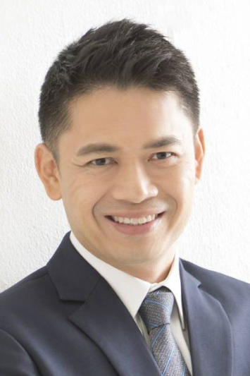 Smiling professional man in a suit, suitable for a lawyer or legal advisor's profile photo.